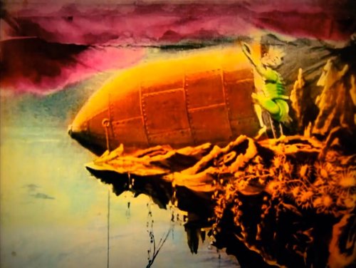 Selenite on Rocky Ledge Watches Airship — Trip to the Moon (1902 Film)